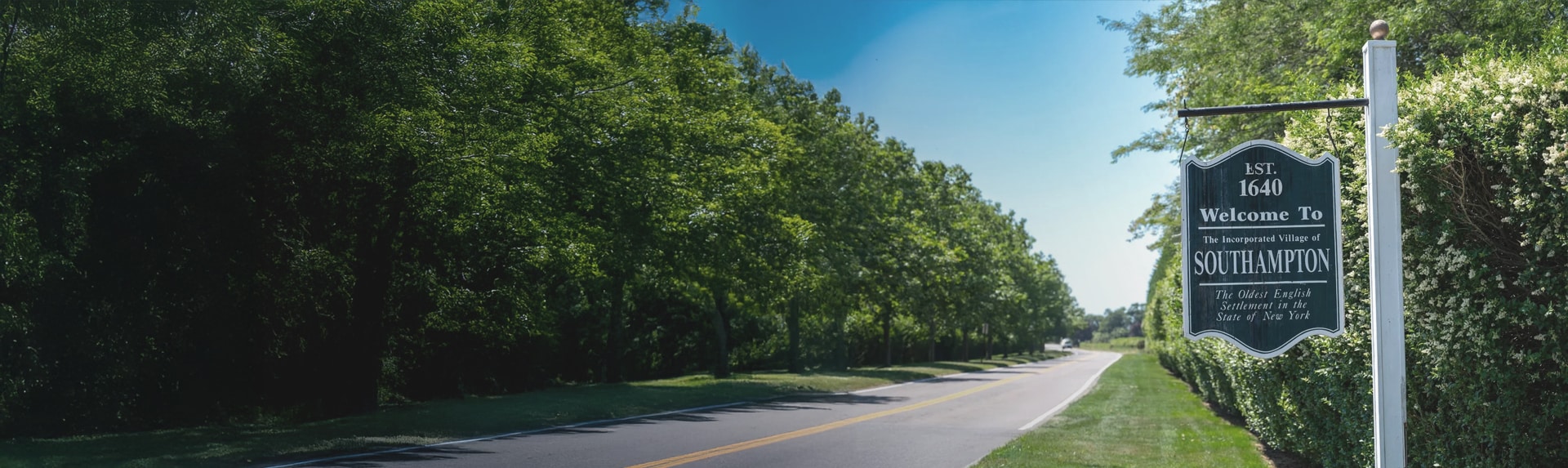 road with an old sign reading Welcome to southampton